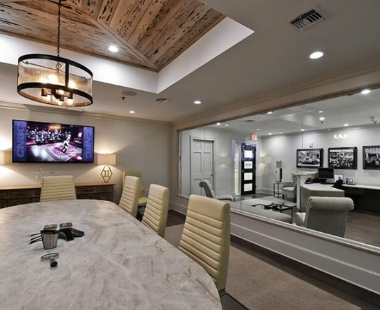 A Living Room Filled With Furniture And A Flat Screen Tv