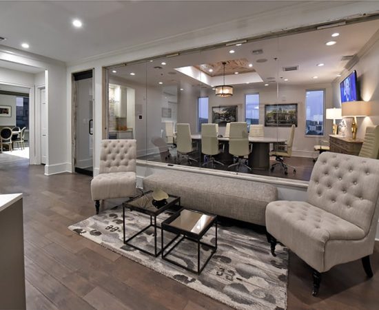 A Living Room Filled With Furniture And A Large Window