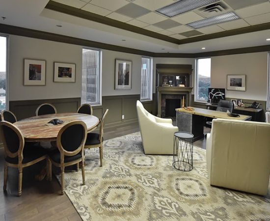 A Living Room Filled With Furniture And A Large Window