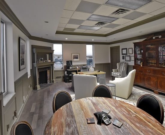 A Kitchen With An Island In The Middle Of A Room